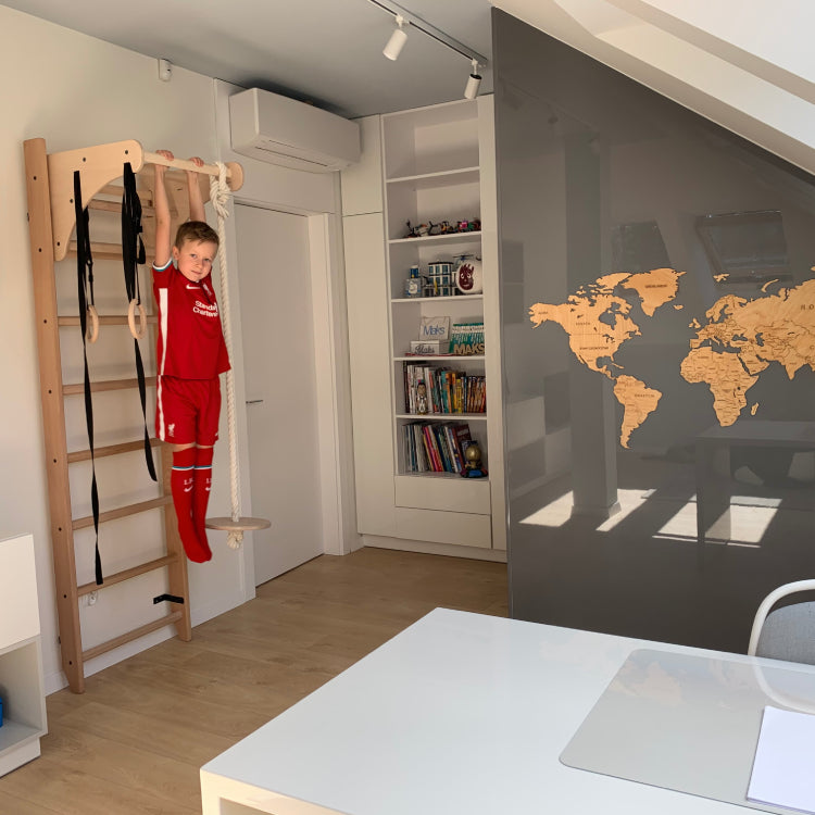 Boy using wall bars