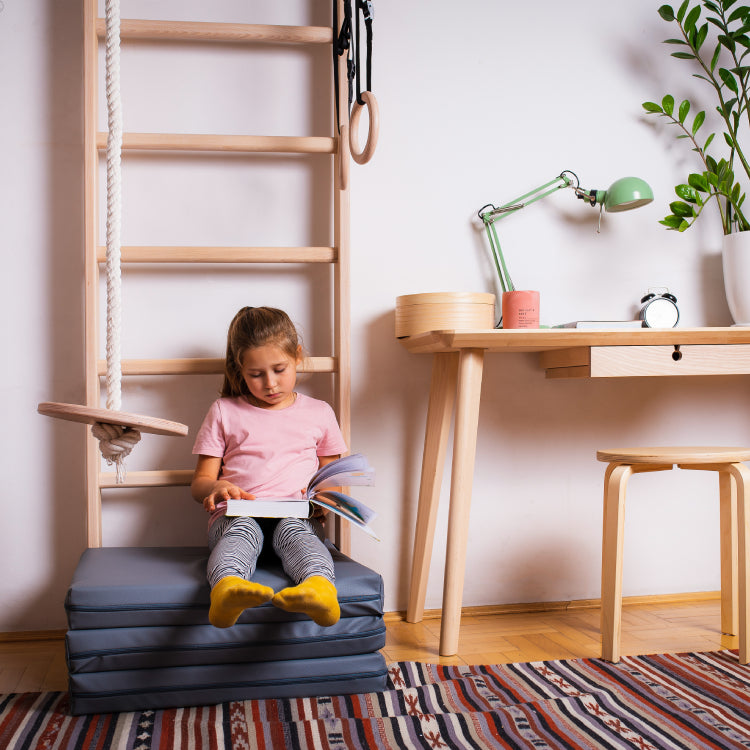 Girl using wall bars