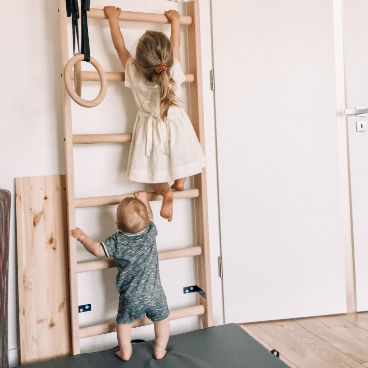 Kids on wall bars