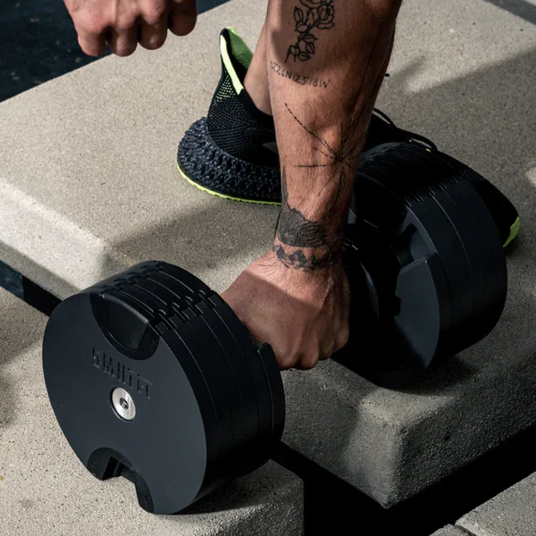 Free weights category including dumbbells, weight plates, and kettlebells for strength training.